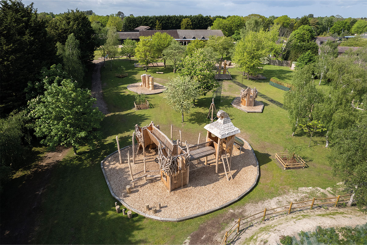 Colour aerial photo of wooden adventure playground at Bainland Lodge Retreats